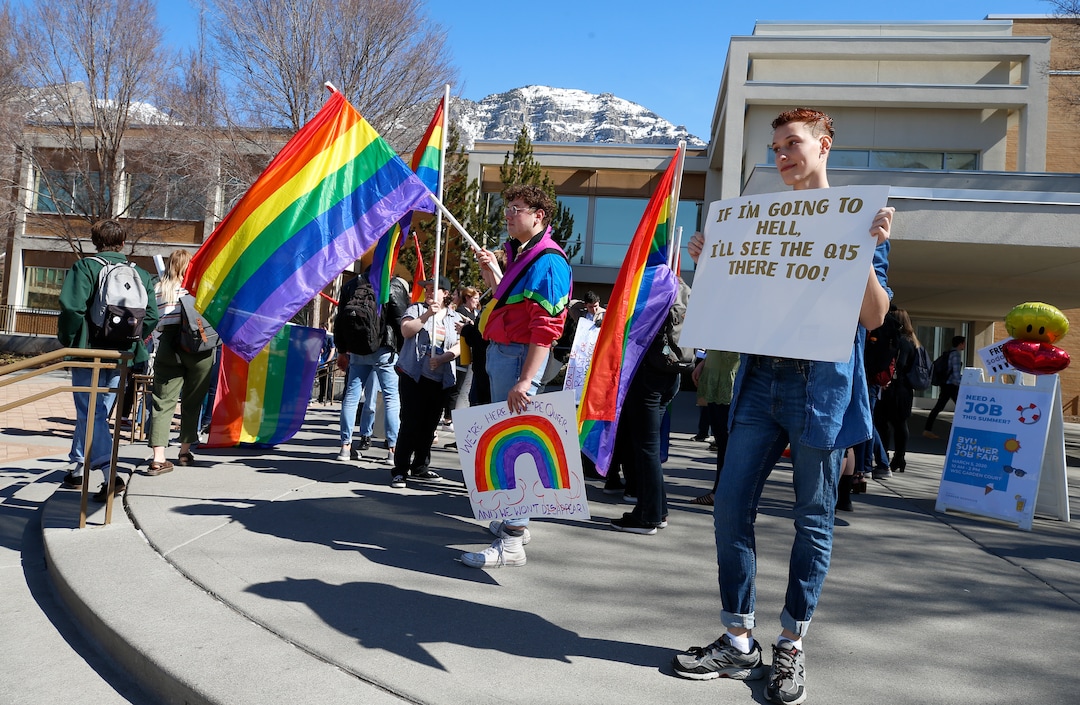 (George Frey  |  special to The Salt Lake Tribune) BYU students and others gather in front of the Ernest L. Wilkinson Student Center on the campus of Brigham Young University to protest BYUÕs rollback of a newly announced policy change on LGBTQ students on March 5, 2020 in Provo, Utah.
