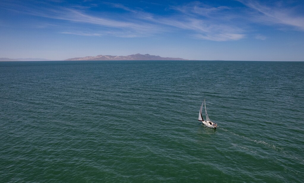 (Francisco Kjolseth | The Salt Lake Tribune) A sailboat catches the wind on the Great Salt Lake as Sailfest returns for the first time in fiver years on Saturday, June 15, 2024. The event was canceled in previous years because of low lake levels and the pandemic.