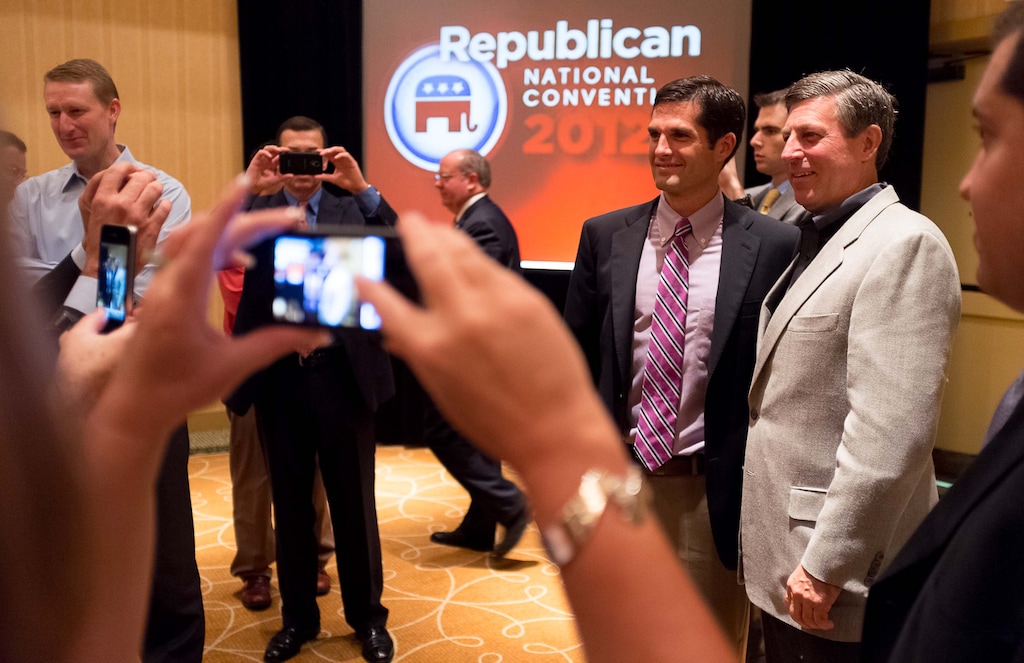 (Trent Nelson | Tribune file photo)
Former Utah Republican Party Chair Bruce Hough, right, has his photograph taken with Matt Romney at the Republican National Convention in Tampa, Florida, Tuesday, August 28, 2012.
