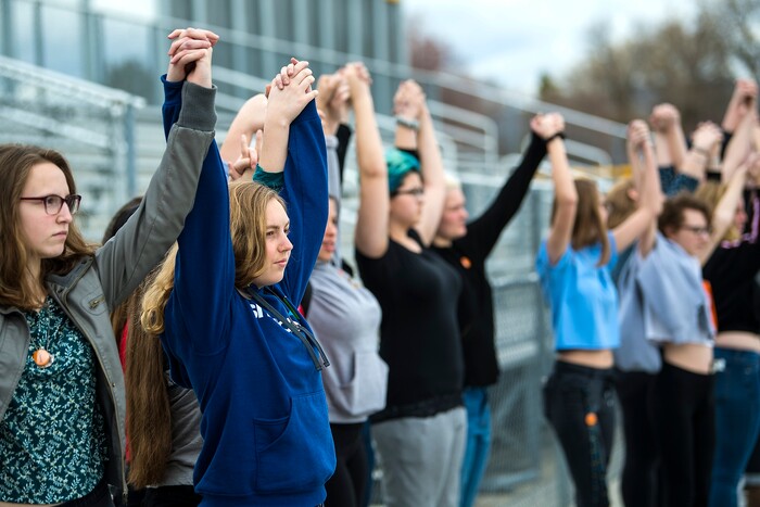 (Chris Detrick  |  The Salt Lake Tribune)  Students at Highland High School in Salt Lake City gather on the football field to participate in a nationwide demonstration for better gun safety laws Thursday, March 15, 2018. Students at more than 30 schools along the Wasatch Front, nearly all of them high schools, particiapted in the 17-minute walkout — one minute for each of the Florida students killed.