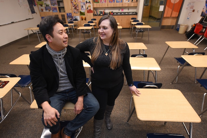 (Francisco Kjolseth  |  The Salt Lake Tribune)  Masa Fukuda, a songwriter, music arranger and director of the One Voice Children's Choir joins his wife Alyssa Fukuda in her classroom at Granger High School where she teaches Japanese. Set up by a friend in July of 2015, the two married a few months later in October. 
