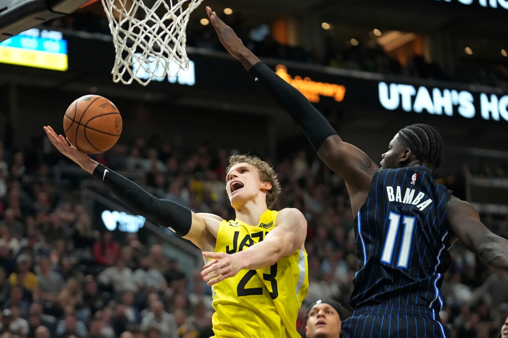 Utah Jazz forward Lauri Markkanen (23) goes to the basket as Orlando Magic center Mo Bamba (11) defends during the second half of an NBA basketball game Friday, Jan. 13, 2023, in Salt Lake City. (AP Photo/Rick Bowmer)