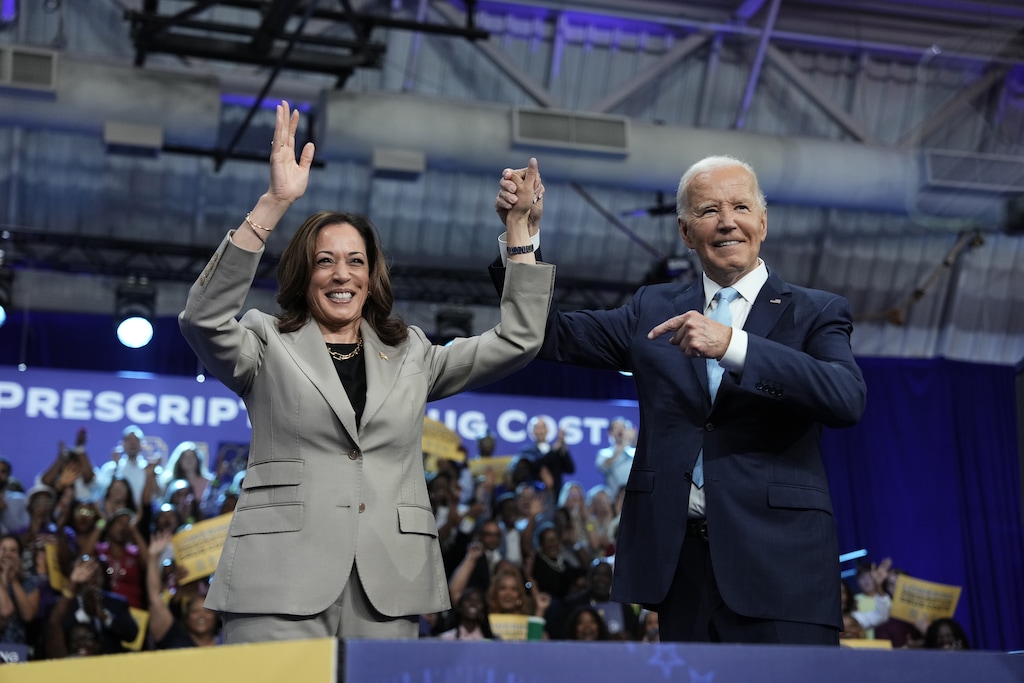 (Eric Lee | The New York Times) President Joe Biden points to Vice President Kamala Harris, the Democratic presidential nominee, during a campaign event at Prince George's Community College in Largo, Md., on Thursday, Aug. 15, 2024.