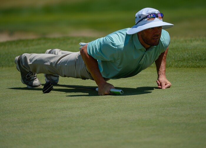 (Francisco Kjolseth  |  The Salt Lake Tribune)  Ray Beaufils of Scottsdale, AZ, lowers his sights for a final stroke as he joins a mixture of local pros and nationwide travelers attempting to qualifying for the Utah Championship on the Web.com Tour and a shot to play in a PGA Tour-brand event at Talons Cove Golf Course in Saratoga Springs on Monday, July 7, 2018. Only 12 players advance from a field of roughly 140.