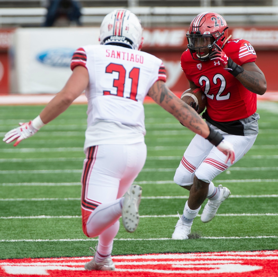 (Rick Egan  |  The Salt Lake Tribune)  Devin Brumfield (22) runs the ball for the red team as Defensive back Keala Santiago defends, in Utah's spring Red-White game at Rice-Eccles Stadium, Saturday, April 13, 2019.