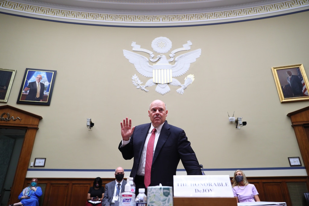 (Tom Brenner | Pool via AP)  Postmaster General Louis DeJoy is sworn in before testifying before a House Oversight and Reform Committee hearing on the Postal Service on Capitol Hill, Monday, Aug. 24, 2020, in Washington.
