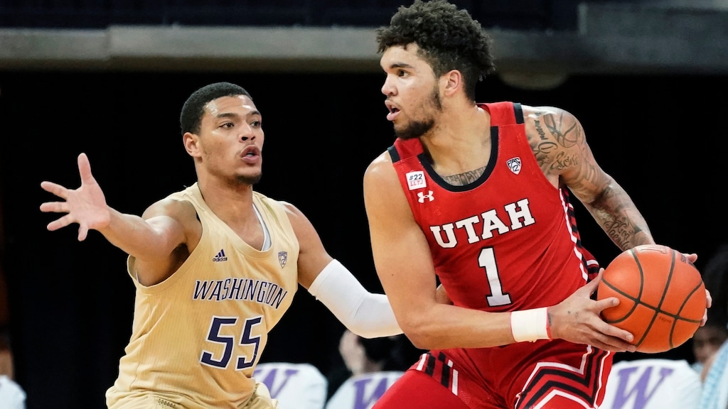 Utah forward Timmy Allen (1) tries to get around Washington guard Quade Green (55) during the first half of an NCAA college basketball game, Sunday, Jan. 24, 2021, in Seattle. (AP Photo/Ted S. Warren)