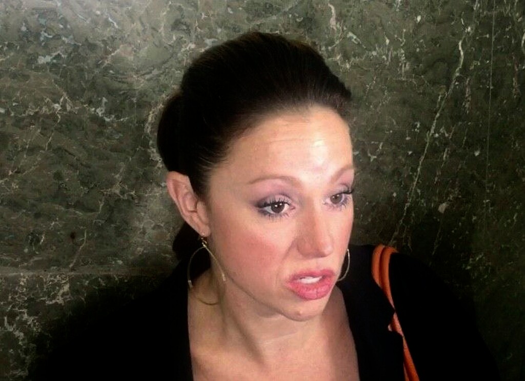 Rebecca Bredow talks to the media outside of Oakland County Circuit Judge Karen McDonald's courtroom Wednesday, Oct. 11, 2017, in Pontiac, Mich. McDonald ruled to reduce the child custody rights of Bredow, who was jailed for five days for not following through on an agreement to vaccinate her 9-year-old son.  (John Wisely /Detroit Free Press via AP)