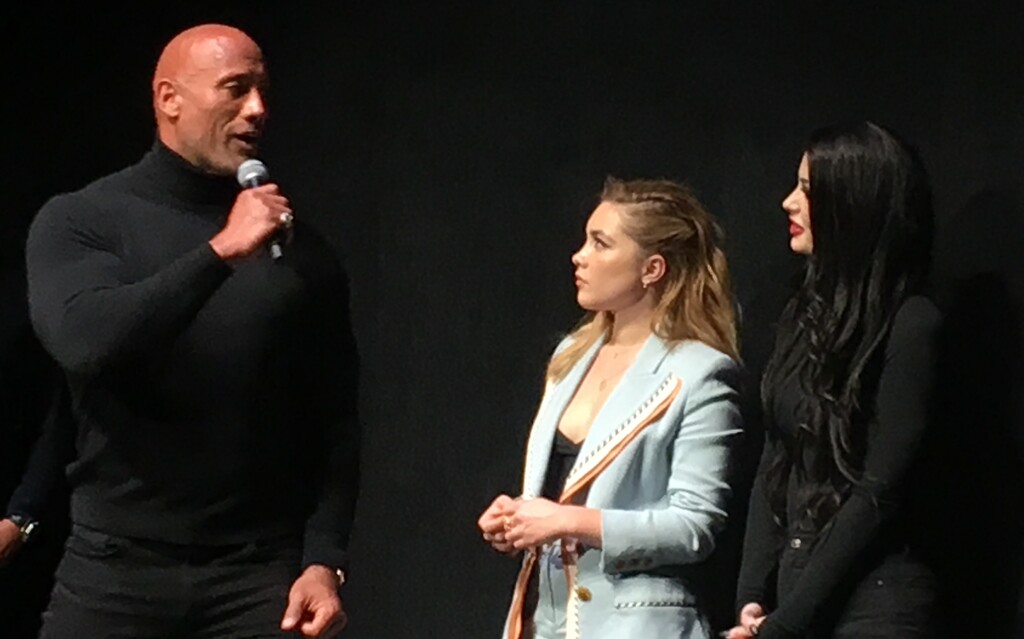 (Sean P. Means  |  The Salt Lake Tribune) Dwayne Johnson, aka "The Rock," left, talks at a Q&A for the true-life comedy "Fighting With My Family" at the film's premiere Monday night at The Ray Theater in Park City as part of the 2019 Sundance Film Festival. With Johnson are the film's star, Florence Pugh, center, and WWE wrestler and personality Paige, whom Pugh plays in the movie.