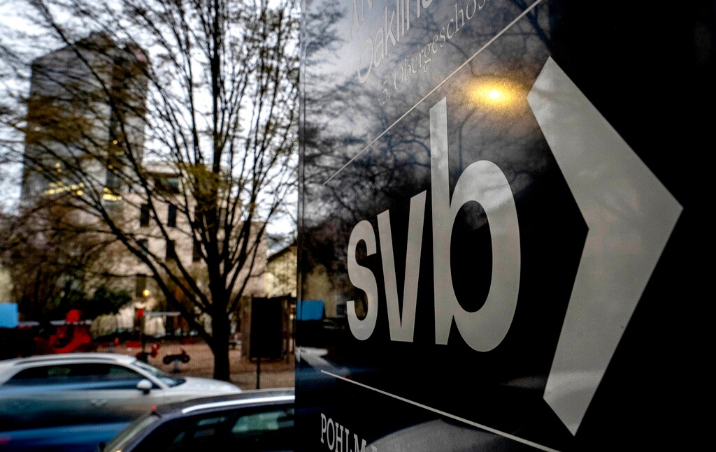 (Michael Probst | AP Photo) A sign of a branch of the Silicon Valley Bank is pictured at an office building where the bank is located in Frankfurt, Germany, Monday, March 13, 2023.