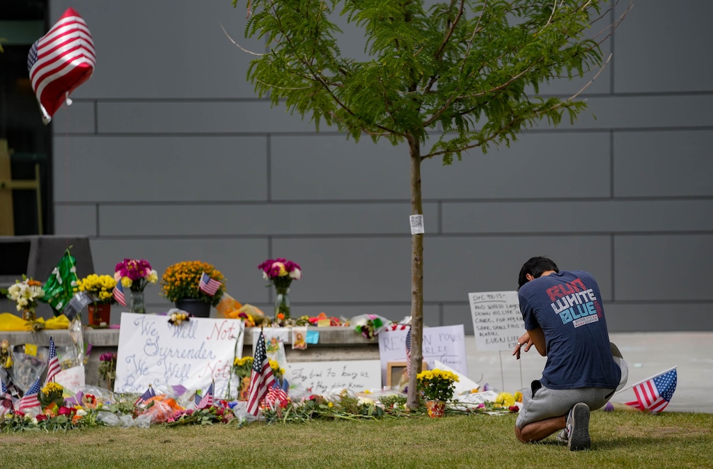 (Francisco Kjolseth | The Salt Lake Tribune) People visit a makeshift memorial for Charlie Kirk at Utah Valley University on Friday, Sept. 19, 2025. The university announced Monday that a committee will develop an on-campus memorial.