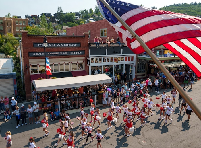 (Leah Hogsten | The Salt Lake Tribune) Park City High School band and cheer squad walk down Main Street in Park City on Labor Day, Sept. 6, 2021 during its 125th anniversary celebration of MinersÕ Day.