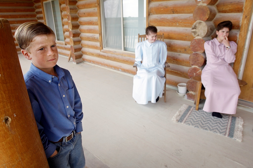 (Eric Gay  |  AP Photo)  Wendell Jessop, 10, left, stands on the porch at his home with sisters Pearl, 12, and Yvone, 16, on the Yearning for Zion Ranch in Eldorado, Texas, Friday, March 27, 2009.