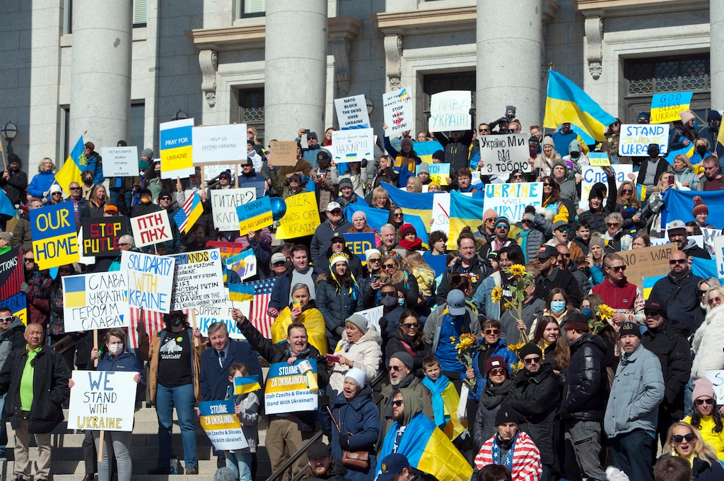 (Ed Kosmicki | Special to The Tribune) Participants hold flags, signs and sunflowers, the national flower of Ukraine, during a rally on the Utah Capitol steps Saturday, Feb. 26 2022. An estimated 500 people attended the rally in solidarity with Ukraine, which was invaded by Russia.