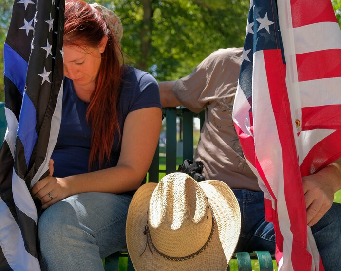 (Leah Hogsten | The Salt Lake Tribune) Alexis Wheeler and her husband Rick join in prayer at Back the Blue rally in support of law enforcement, Saturday, August 15, 2020 at Washington Square.
