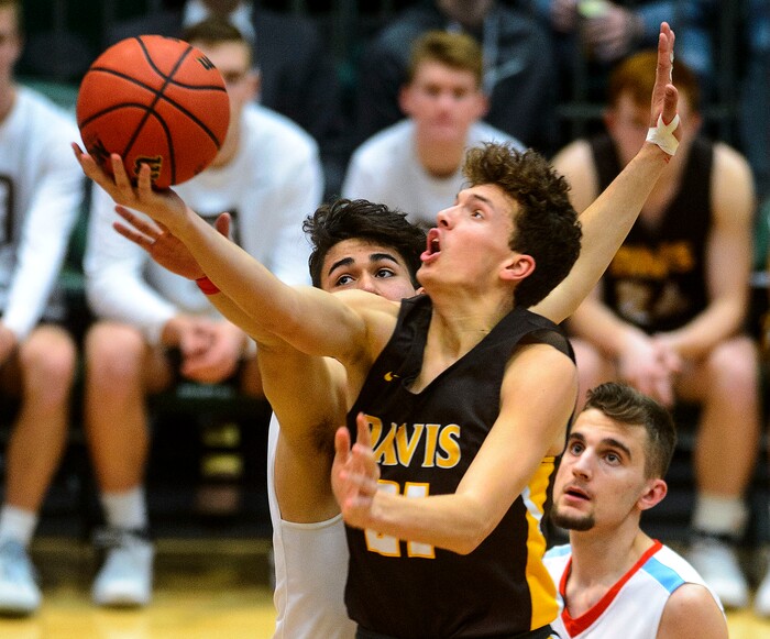 (Steve Griffin  |  The Salt Lake Tribune) Davis guard Tyson Garff scopes up a shot at the rim during the Granger versus Davis 6A basketball playoff game at Utah Valley UniversityÕs UCCU Center in Provo Tuesday Feb. 27, 2018.