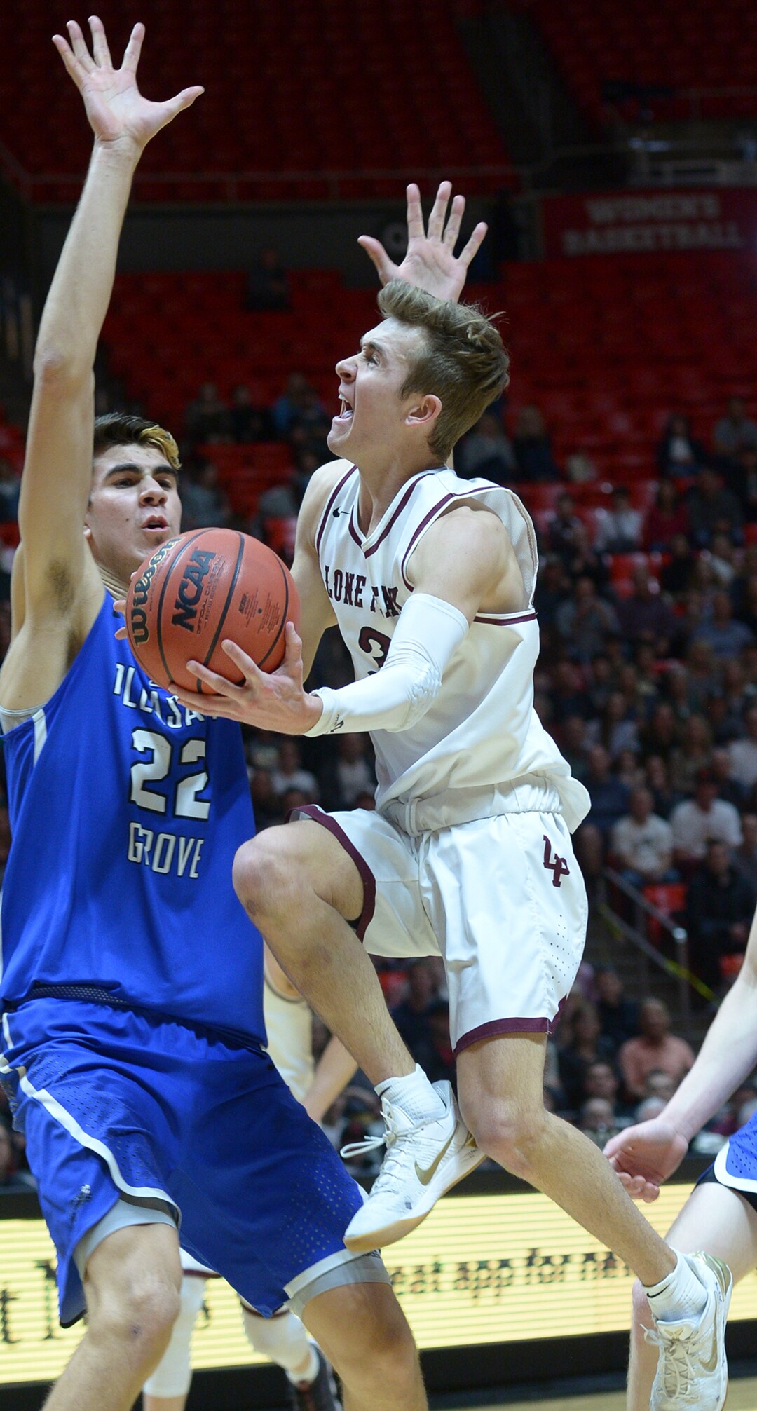 (Leah Hogsten  |  The Salt Lake Tribune) Lone Peak's Steven Ashworth (03) slips past Pleasant Grove's Matt Van Komen (22). Pleasant Grove plays Lone Peak to win the 6A High School BoysÕ Basketball Tournament Championship at the Jon M. Huntsman Center in Salt Lake City, Saturday, March 3, 2018. 