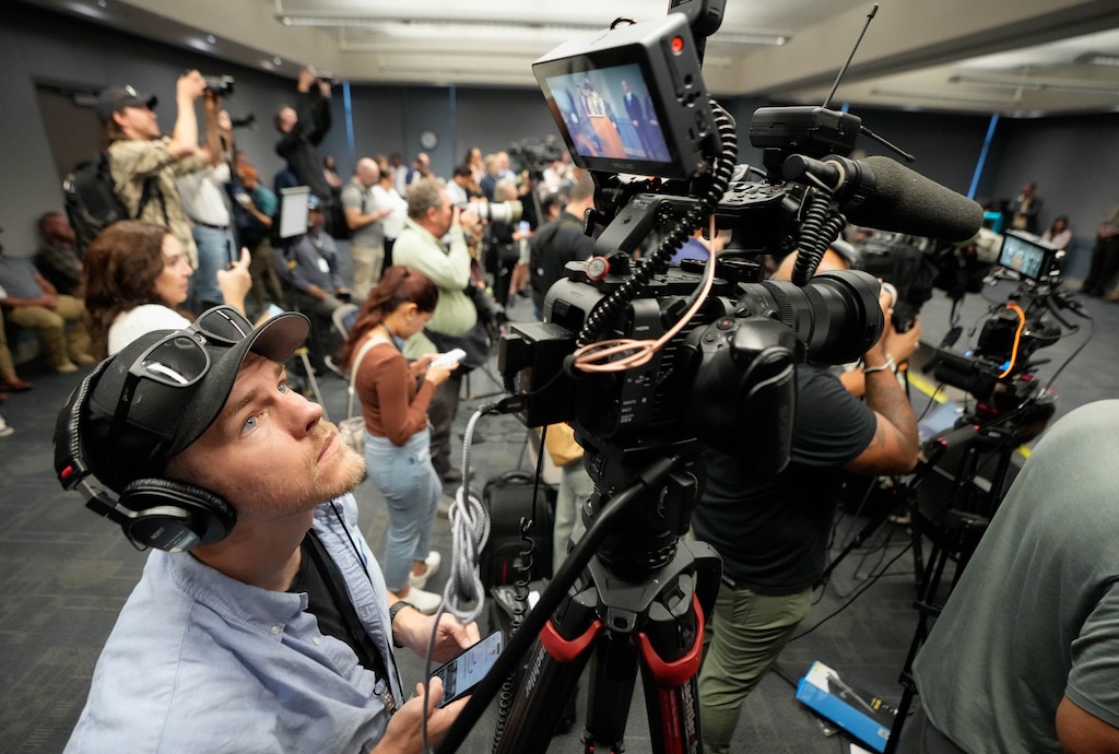 (Francisco Kjolseth | The Salt Lake Tribune) Tribune videographer Trevor Christensen documents a news conference as charges are announced for Tyler Robinson, the alleged shooter of Charley Kirk, at the Utah County Health and Justice building in Provo, on Tuesday, Sept. 16, 2025.