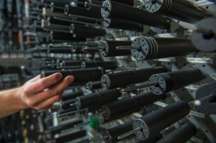 Leah Hogsten | The Salt Lake Tribune
Silencerco's public relations specialist Matt Pinnell places a Silencerco Saker ASR silencer back on a rack of silencers in the company's gun safe. Silencerco is one of the country's largest manufacturers of silencer for guns of all kinds, Friday, May 28, 2017.
