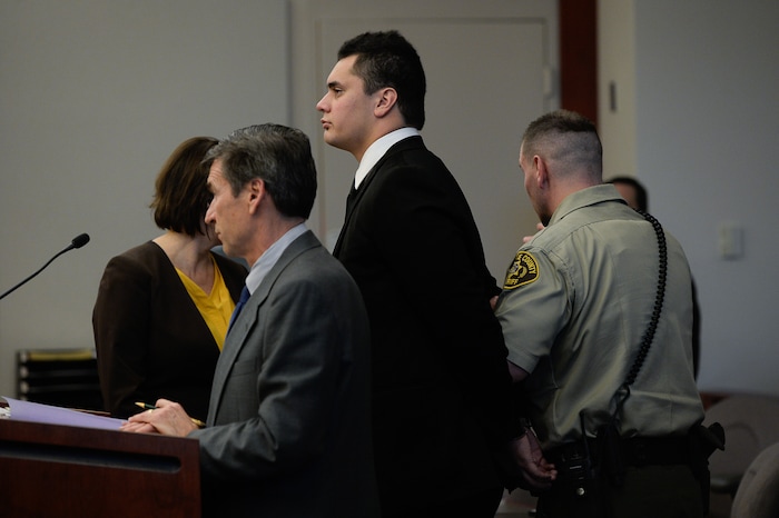 (Francisco Kjolseth  |  The Salt Lake Tribune)  Former Brighton High and University of Southern California linebacker Osa Masina, center, is taken into custody during his sentencing for sexual battery at the Matheson Courthouse in Salt Lake City on Tuesday, Dec. 5, 2017. Masina was sentenced to 365 days in jail, followed by two years on probation.