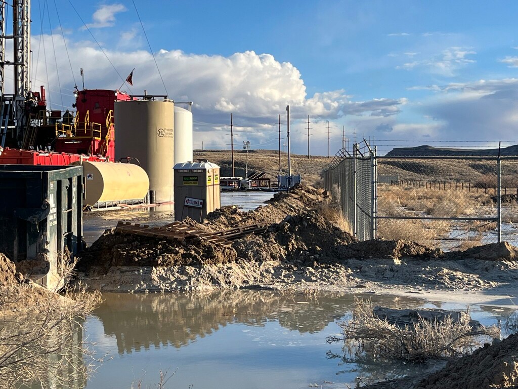 (Christine Sheeter) Water pools by Blackstone Minerals well operation in Green River on Friday, March 8.