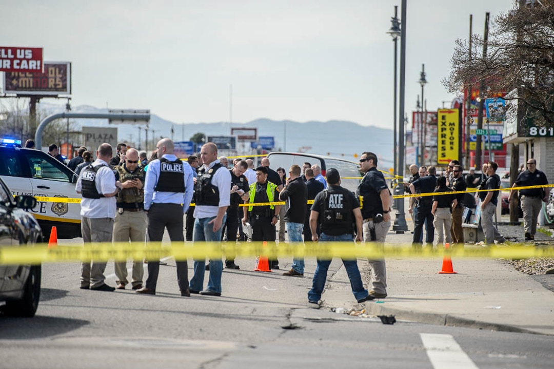 (Trent Nelson  |  The Salt Lake Tribune)  Law enforcement at the scene of a shootout near 3300 South State Street in South Salt Lake on Monday April 8, 2019.