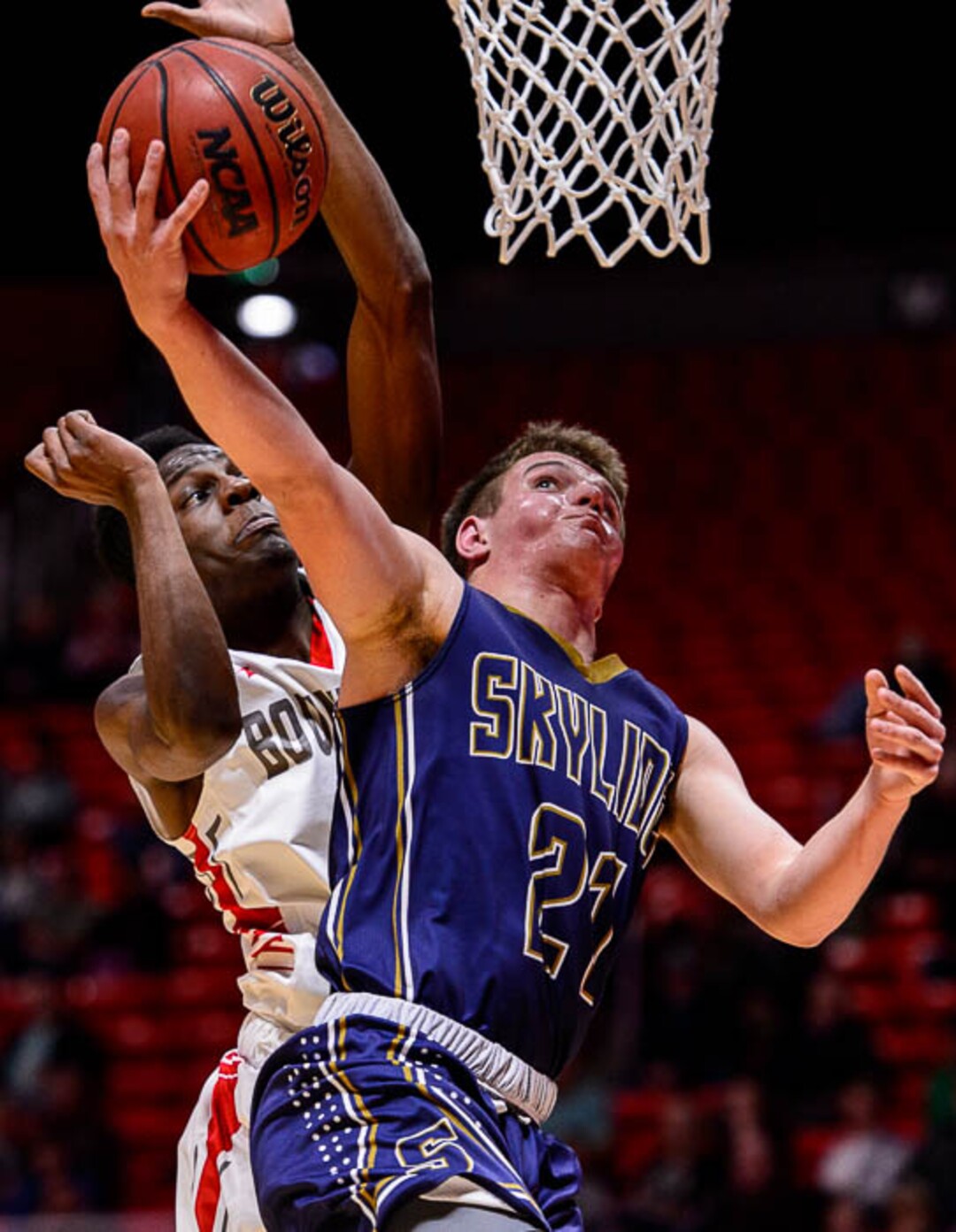 (Trent Nelson | The Salt Lake Tribune)  Skyline vs. Bountiful, 5A State high school basketball tournament at the Huntsman Center in Salt Lake City, Wednesday Feb. 28, 2018. Skyline's Taylor Larsen (21) shoots ahead of Bountiful's Jaxon Wood (5).