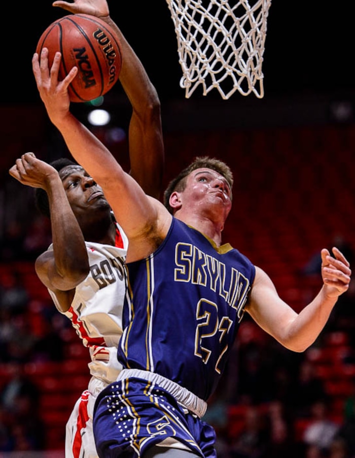 (Trent Nelson | The Salt Lake Tribune)  Skyline vs. Bountiful, 5A State high school basketball tournament at the Huntsman Center in Salt Lake City, Wednesday Feb. 28, 2018. Skyline's Taylor Larsen (21) shoots ahead of Bountiful's Jaxon Wood (5).