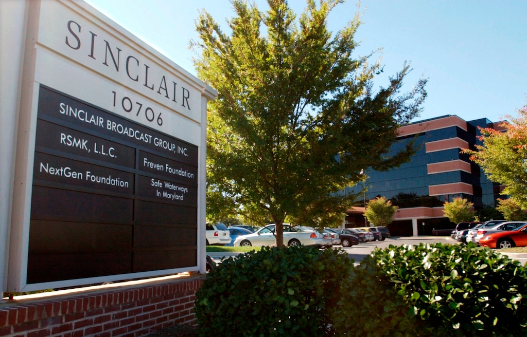 (Steve Ruark | The Associated Press) In this Oct. 12, 2004, file photo, Sinclair Broadcast Group Inc.'s headquarters stands in Hunt Valley, Md.  Media company Twenty-First Century Fox is buying seven TV stations from Sinclair Broadcast Group for $910 million. The move comes as Sinclair is selling some stations to meet regulatory approval for its pending $3.9 billion acquisition of Tribune Media.