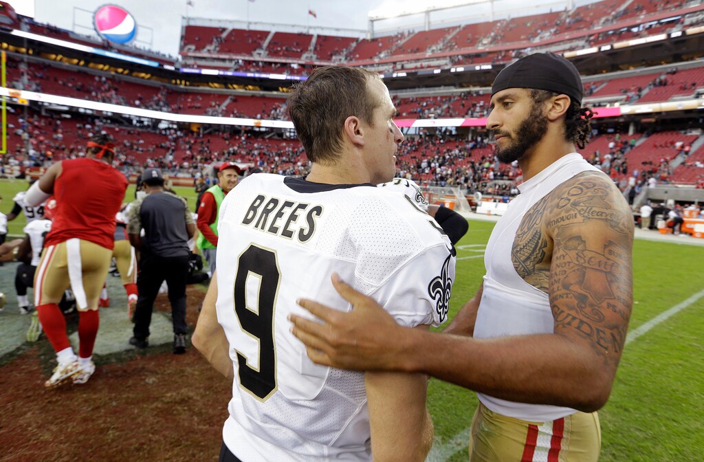 FILE - In this Nov. 6, 2016, file photo, San Francisco 49ers quarterback Colin Kaepernick, right, is greeted by New Orleans Saints quarterback Drew Brees at the end of an NFL football game in Santa Clara, Calif. As athletes and sports organizations around the world speak out against racial injustice in the wake of George Floyd’s death, Drew Brees drew sharp criticism after he reiterated his opposition to Colin Kaepernick’s kneeling during the national anthem in 2016. (AP Photo/D. Ross Cameron, File)