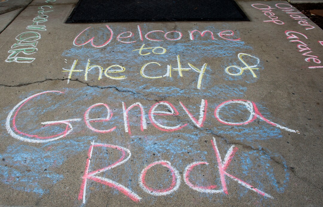(Rick Egan  |  The Salt Lake Tribune)   Carolyn Hoffert and Angie Parkin and their kids draw chalk art on the sidewalk at Lehi City Hall to protest the expansion of Geneva Rock's mining activities near their neighborhood, Tuesday, April 2, 2019.