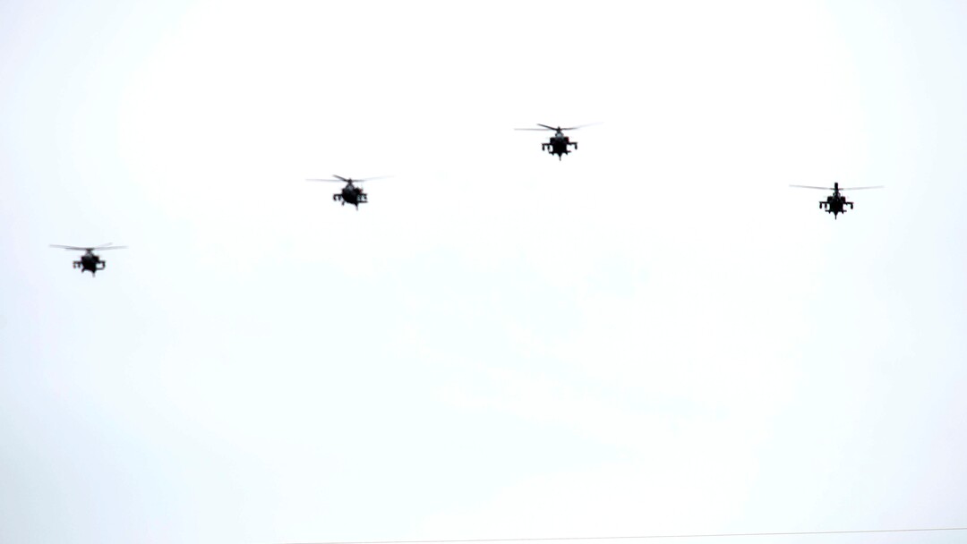 (Rick Egan  |  The Salt Lake Tribune)     Apache Helicopters with the Utah National Guard 1-211 Attack Reconnaissance Battalion fly over the Veterans Memorial Park, in Bluffdale during the graveside service for 2nd Lt. Lynn W. Hadfield, Thursday, March 21, 2019.