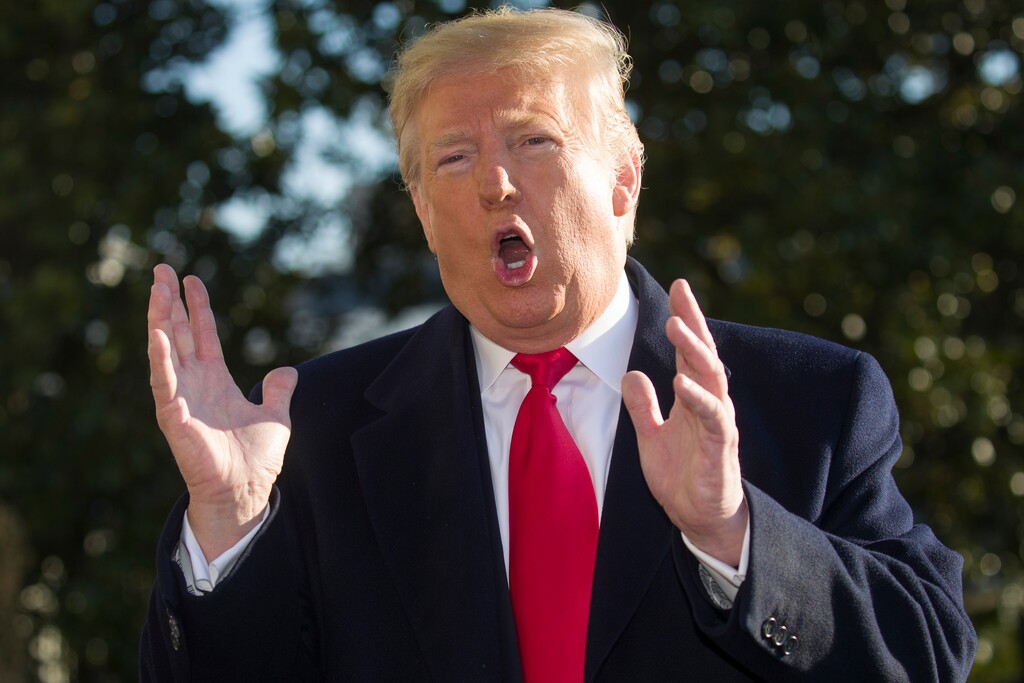 President Donald Trump speaks on the South Lawn of the White House as he walks to Marine One, Sunday, Jan. 6, 2019, in Washington. Trump is en route to Camp David. (AP Photo/Alex Brandon)