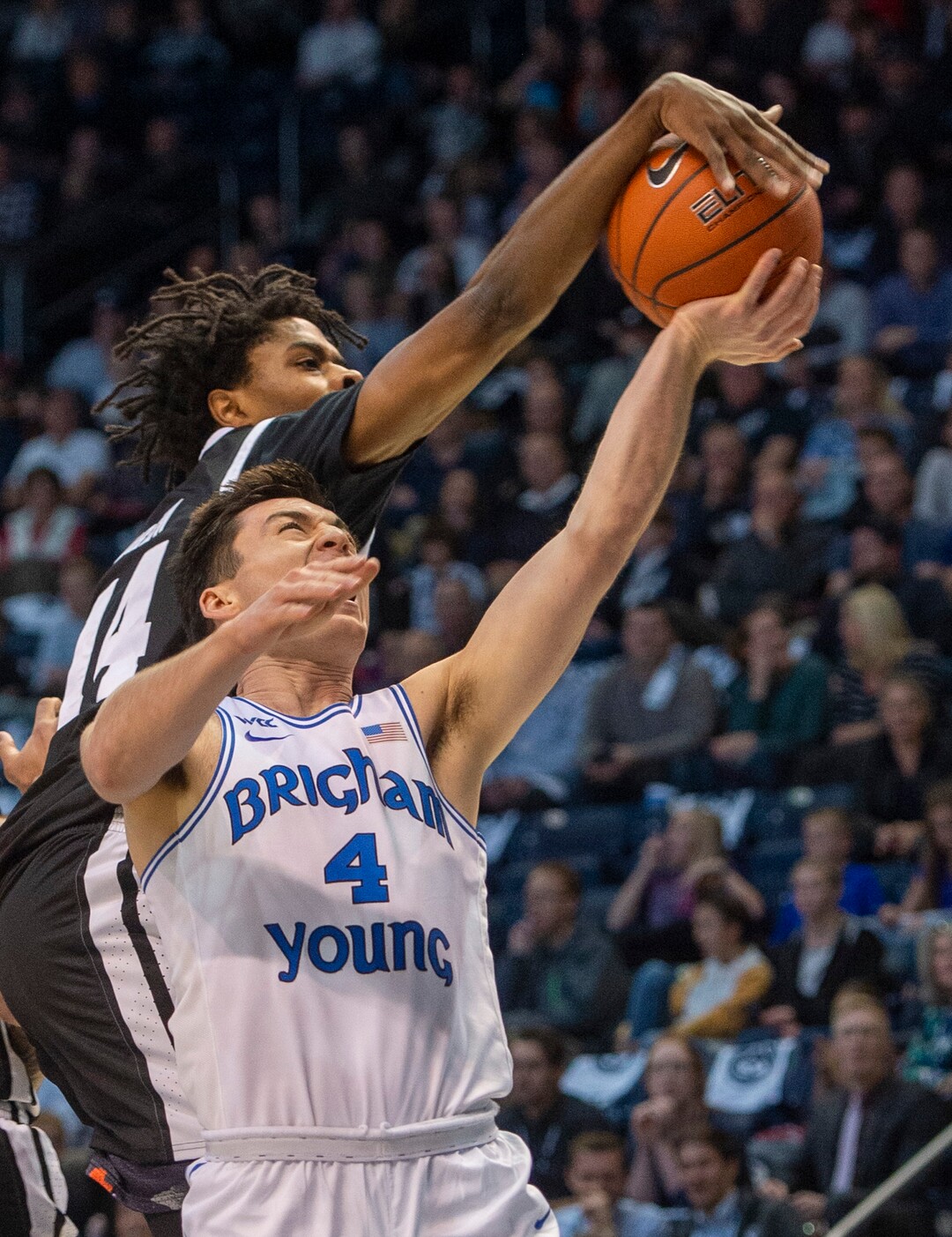 (Rick Egan  |  The Salt Lake Tribune)       Nevada Wolf Pack guard Lindsey Drew (14) blocks a shot by Brigham Young Cougars guard Alex Barcello (4), in basketball action between the Brigham Young Cougars and the Nevada Wolf Pack, at the Marriott Center, in Provo, Saturday, December 10, 2019.
