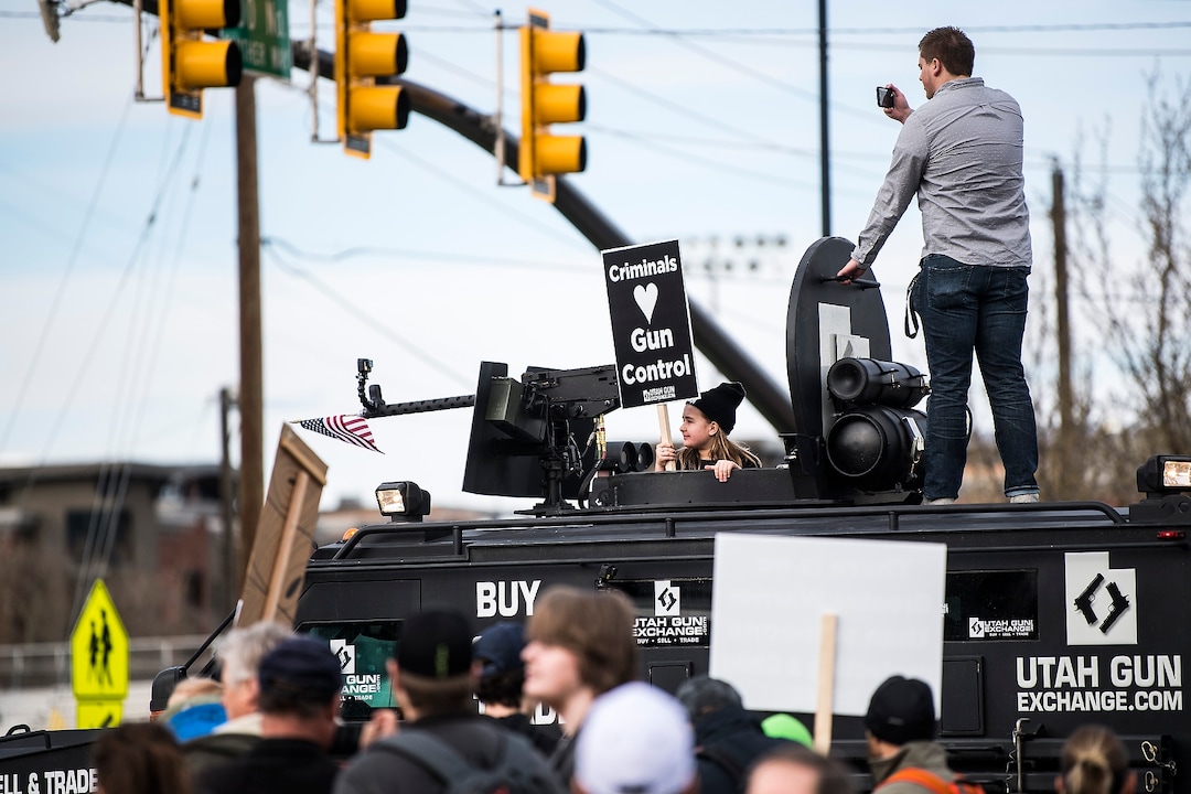 (Chris Detrick | The Salt Lake Tribune)  Participants hold signs during the March Before Our Lives rally near West High School in Salt Lake City Saturday, March 24, 2018.