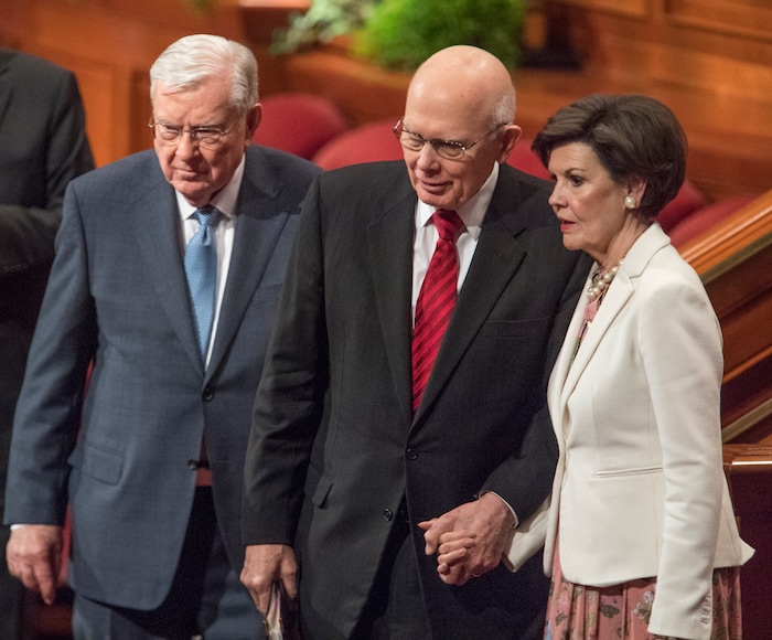 (Rick Egan  |  The Salt Lake Tribune)          Elder M. Russell Ballard , Dallin H. Oaks, and his wife, sister Kristen Oaks, after the Saturday morning session of the188th Annual General Conference in Salt Lake City,  Saturday, March 31, 2018.