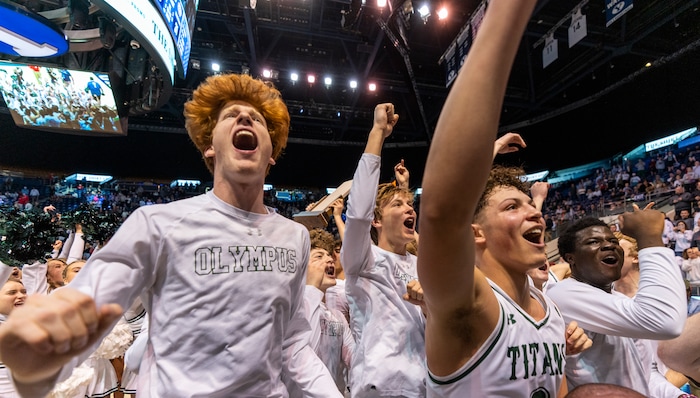 (Rick Egan | The Salt Lake Tribune) the Olympus titans celebrate their win in the 5A State Championship game between Woods Cross and Olympus, at the Marriott Center in Provo, on Saturday, March 5, 2022. 