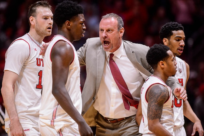 (Trent Nelson | The Salt Lake Tribune)  Utah coach Larry Krystkowiak with his players after a score as the University of Utah hosts USC, NCAA basketball at the Huntsman Center in Salt Lake City, Saturday Feb. 24, 2018.