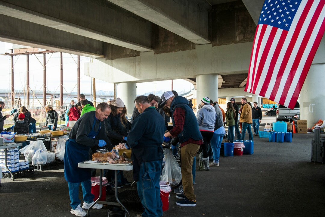 (Chris Detrick  |  The Salt Lake Tribune)  Volunteers prepare Thanksgiving Day meals during the Eagle Ranch Chuckwagon under the viaduct at 500 South and 600 West in Salt Lake City Thursday, November 23, 2017.  