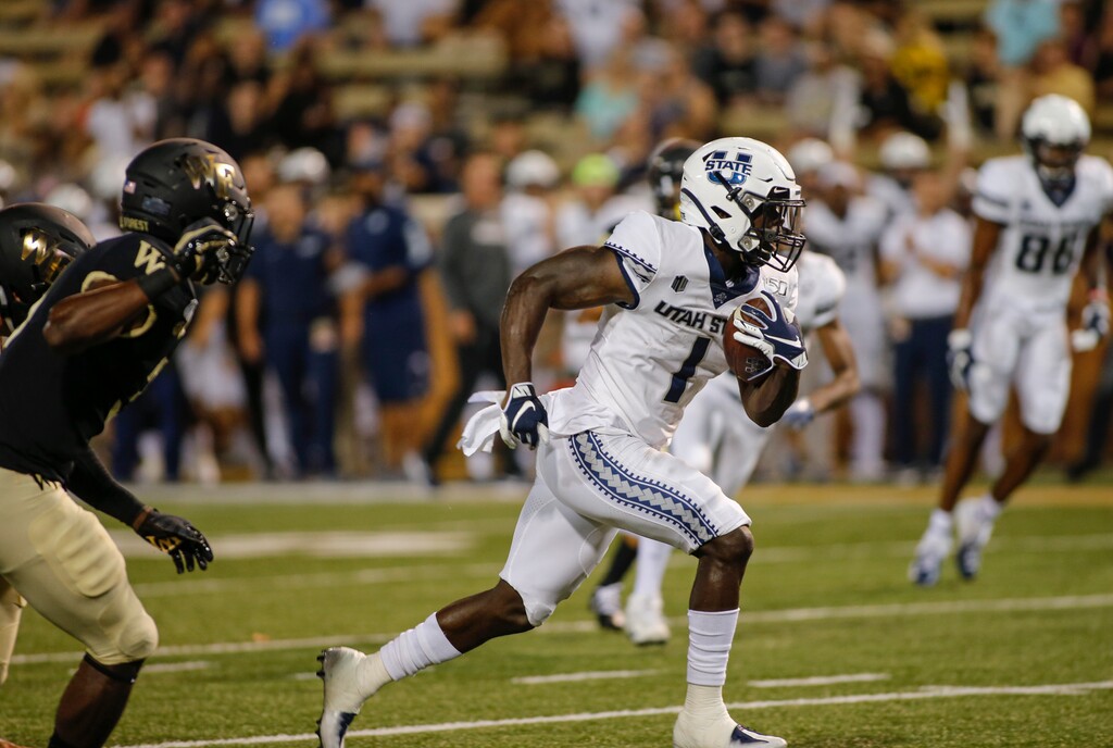 Utah State back Gerold Bright (1) rushes for a first-half touchdown against Wake Forest in an NCAA college football game in Winston-Salem, N.C., Friday, Aug. 30, 2019. (AP Photo/Nell Redmond)
