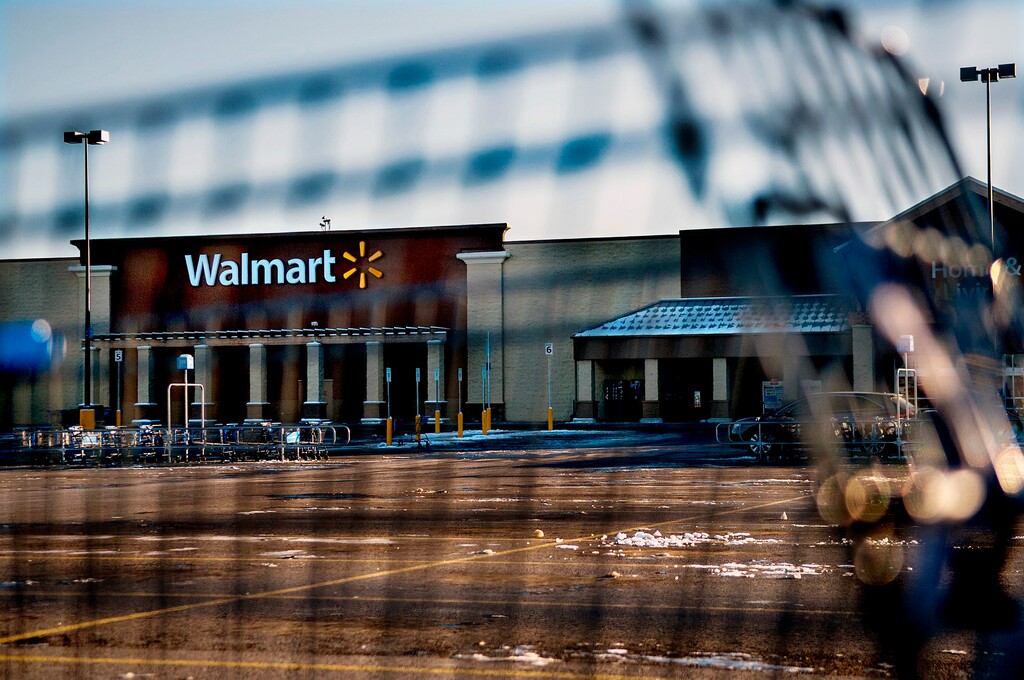 (Kathy Plonka | The Spokesman-Review via The Associated Press) This photo shows Walmart with a shopping cart in the foreground in Hayden, Idaho, Tuesday, Dec. 30, 2014. Walmart on Wednesday said it will no longer sell firearms and ammunition to people younger than 21.
