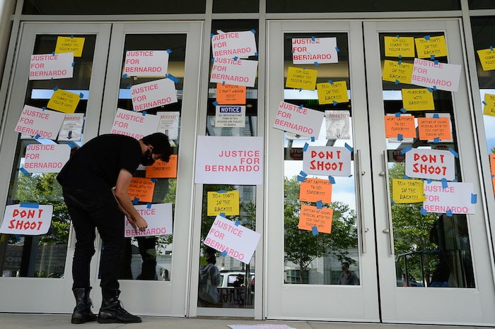 (Francisco Kjolseth  |  The Salt Lake Tribune) Demonstrators gather at the Salt Lake County District Attorney's office as they plaster the building asking for Justice for Bernardo Palacios Rally, on Thursday, June 18, 2020.