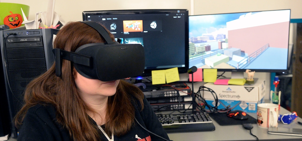 (Al Hartmann | The Salt Lake Tribune) Producer Alanna Carroll wearing virtual reality goggles runs a simulation program that allows her to experience the vision of a person with deteriorating vision due to diabetes at the University of Utah's Entertainment Arts and Engineering program.