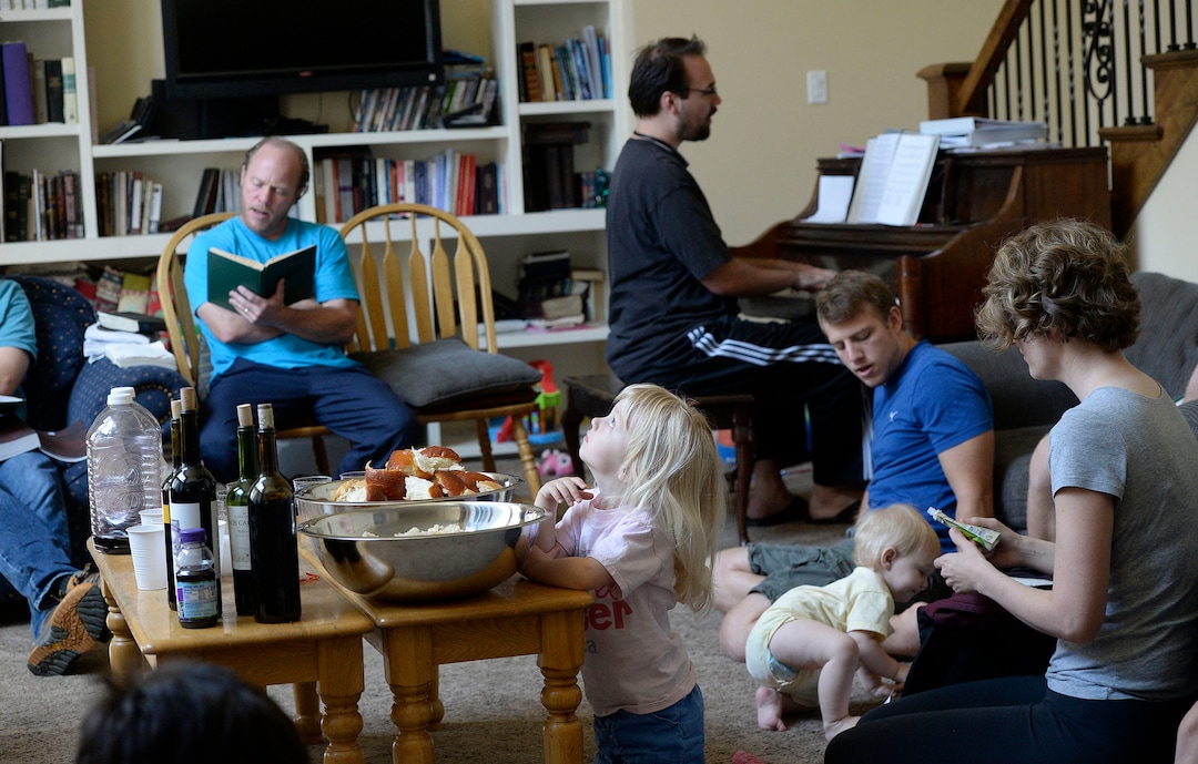 (Al Hartmann  |  The Salt Lake Tribune)
Believers in Denver Snuffer's Remnant movement gather in a Sandy home for a fellowship meeting Sunday, Aug. 13, to sing songs and partake of the sacrament.