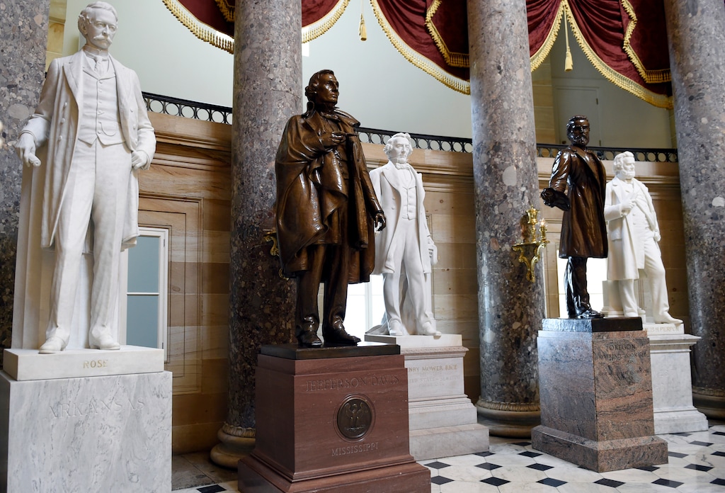(Susan Walsh | The Associated Press) In this June 24, 2015, photo, a statue of Jefferson Davis, second from left, president of the Confederate States from 1861 to 1865, is on display in Statuary Hall on Capitol Hill in Washington. Utah's all-Republican House delegation split on a push to remove Confederate statues from the building.