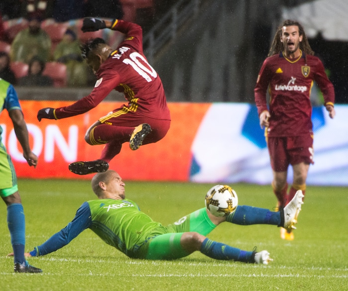 (Rick Egan  |  The Salt Lake Tribune)  Real Salt Lake forward Joao Plata (10) leaps over Seattle Sounders midfielder Osvaldo Alonso (6), as he goes for the ball, in MLS soccer action, Real Salt Lake vs Seattle Sounders, in Sandy, Utah, Saturday, September 23, 2017.