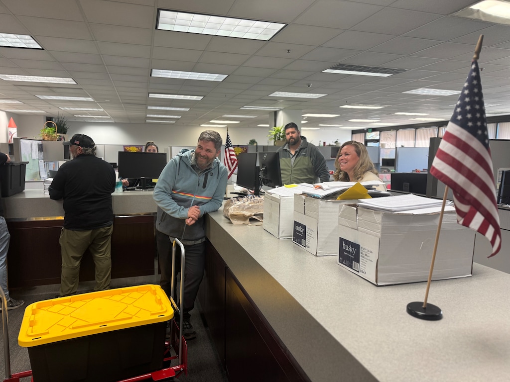 (Robert Gehrke | The Salt Lake Tribune) Utah Republican Party Chair Rob Axson and members of Utahns For Representative Government delivered hundreds of signature packets to Salt Lake County Clerk Lannie Chapman ahead of Sunday's deadline to submit signatures for an initiative to repeal Proposition 4 and remove a prohibition on gerrymandering political districts.
