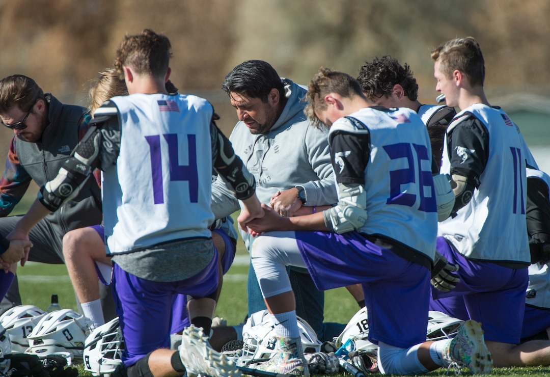 (Rick Egan | The Salt Lake Tribune) Box Elder High School lacrosse coach Juan Gaytan says a prayer with his players before a tournament in Logan on Saturday, Nov. 3, 2018.