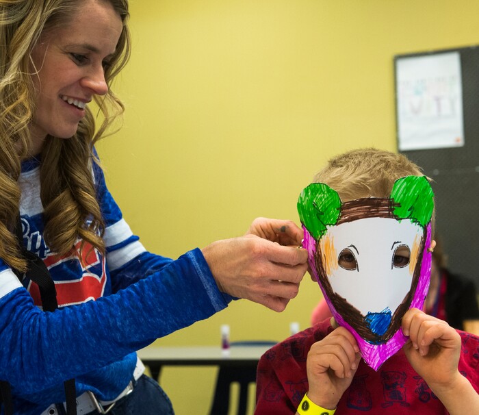 (Rick Egan  |  The Salt Lake Tribune)  Donna Bushman helps Alex Bushman, 6, try on the bear mask he made at the Discovery Gateway, New Years Day celebration of cultural traditions from around the world including Romania, Iran, and Myanmar. In Romania they celebrate the new year with a dance called "Dance of the Bear". Monday, January 1, 2018.