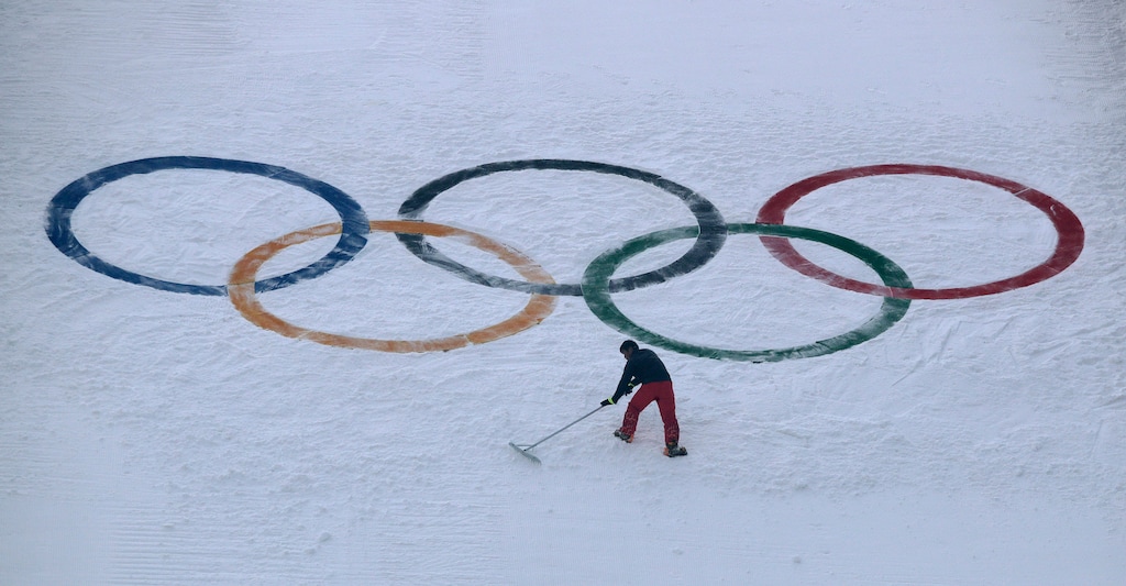 (AP Photo | Charlie Riedel, File) In this Feb. 10, 2018, file photo, a worker grooms the snow after installing a set of Olympic Rings on the ski jump hill at the 2018 Winter Olympics at the Alpensia Ski Jumping Center in Pyeongchang, South Korea. Ukraine wants to enter formal talks about hosting the Winter Olympics, the IOC said Monday.
